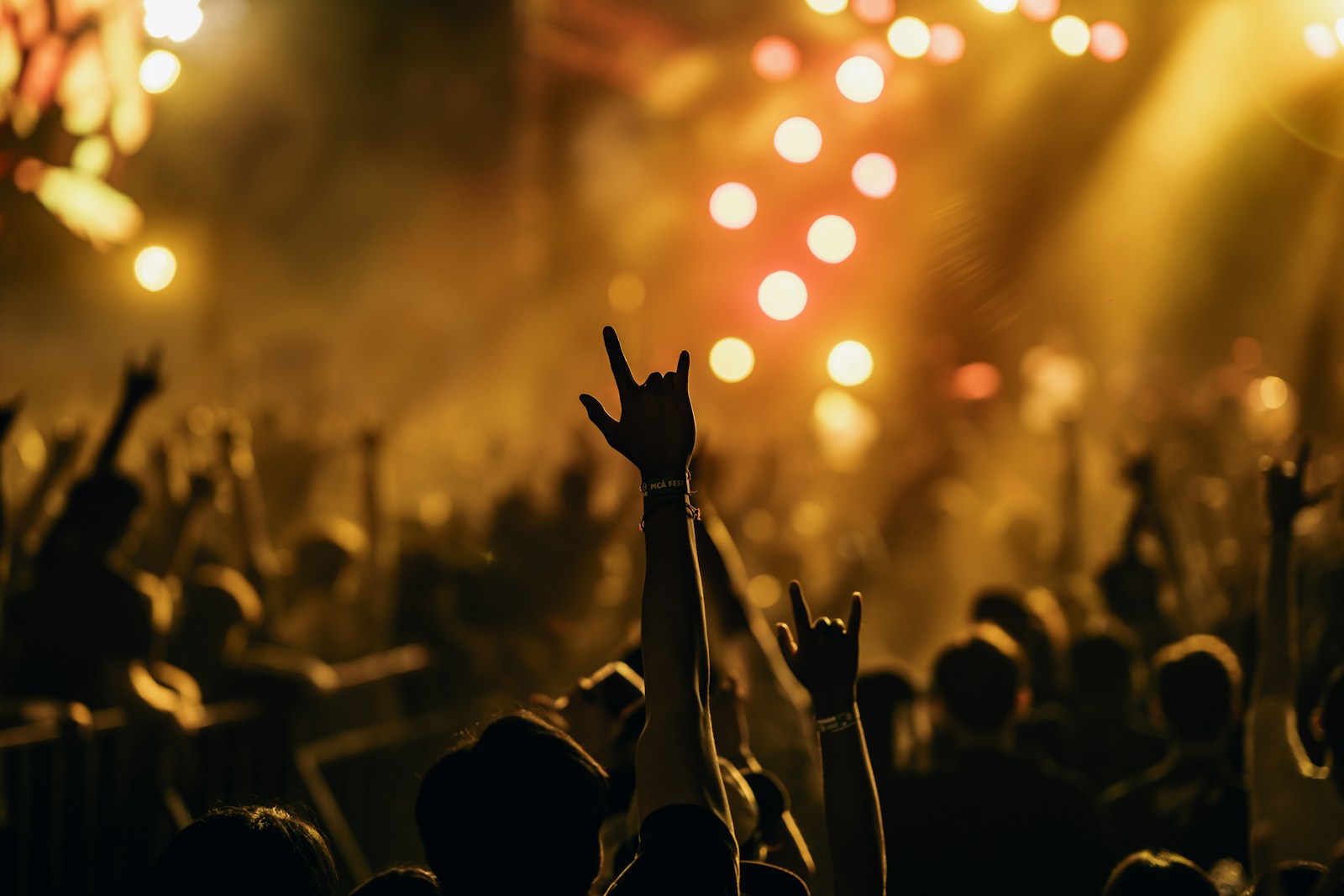 Concert crowd with hands in the air during Maverick City Music In the Room