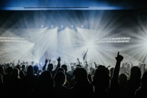Worship concert crowd singing the Jesus at the Center lyrics by Israel Houghton