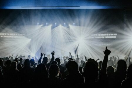 Jesus at the Center Lyrics: Meaning & Story Behind the Worship Classic Worship concert crowd singing the Jesus at the Center lyrics by Israel Houghton